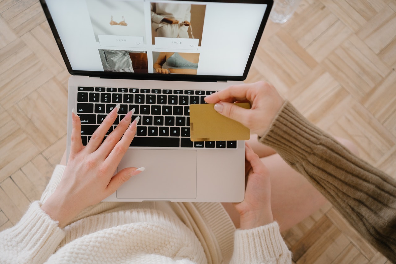 customer using credit card on computer